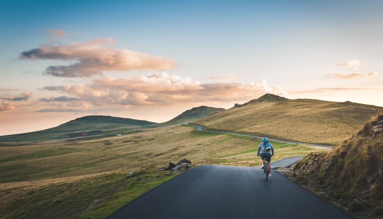 Homepage 3 Cyclists racing through scenic countryside roads during a professional stage race