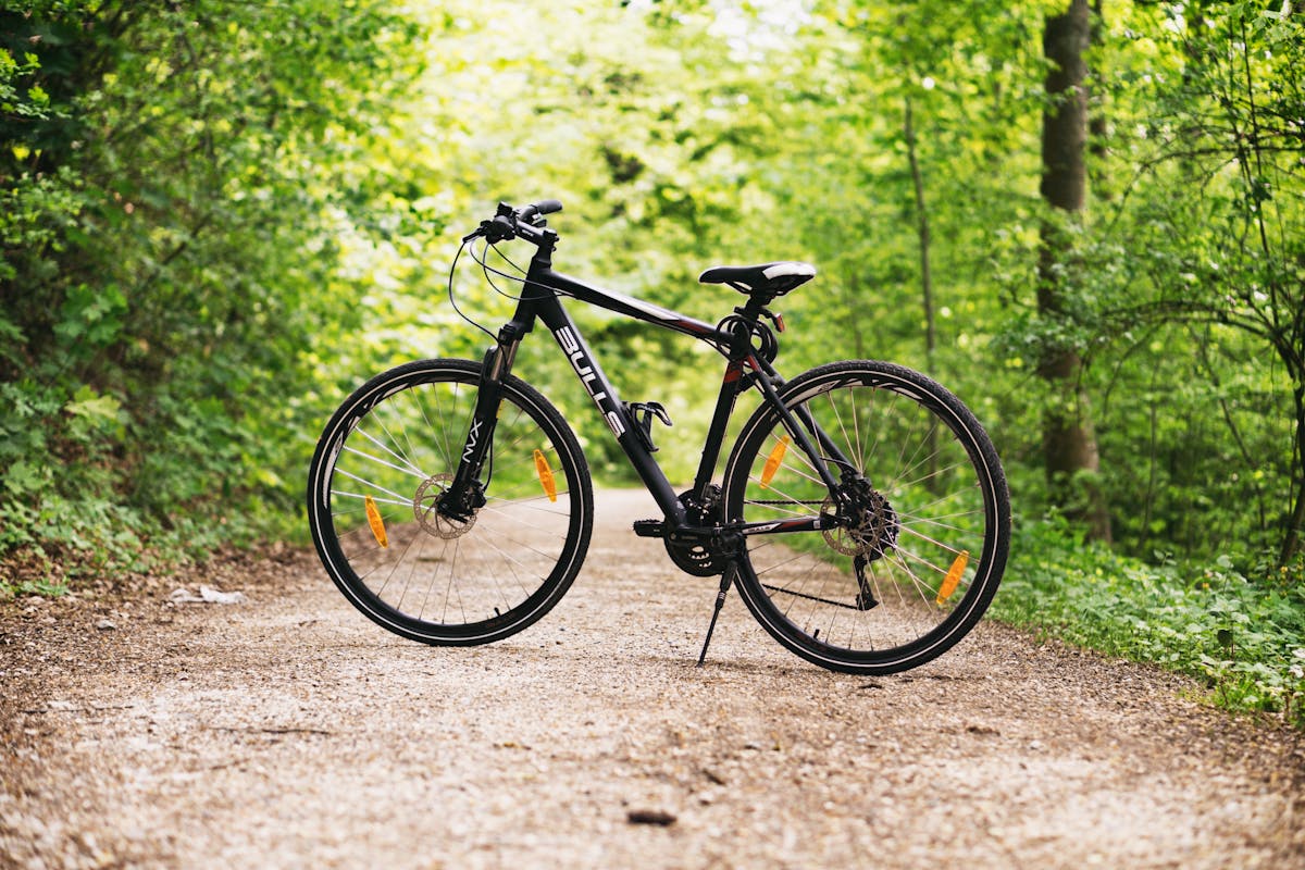 Homepage 19 cyclist using a floor pump to set tire pressure on a road bike