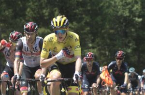 Magazine 7 Tadej Pogačar riding in the Tour de France yellow jersey